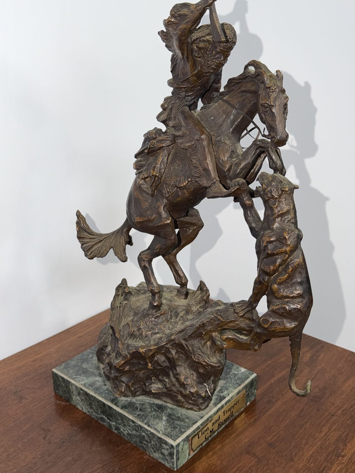 Lion and Trapper Bronze after C.M. Russell