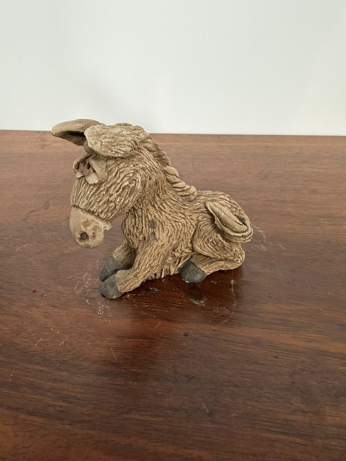 Unmarked Shaggy Sitting Donkey Figurine